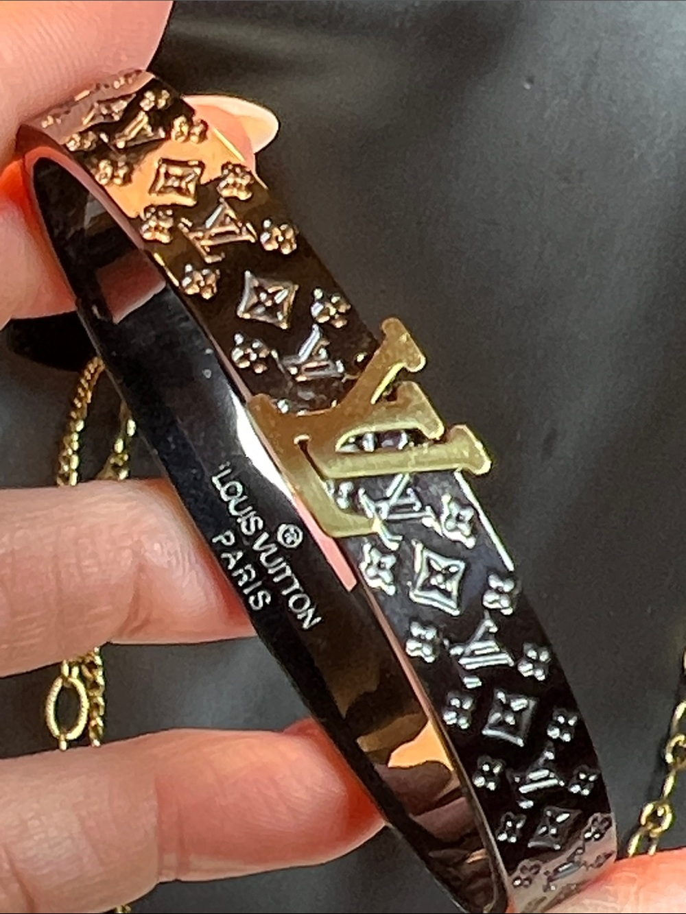 Black Bangle with Gold Emblem